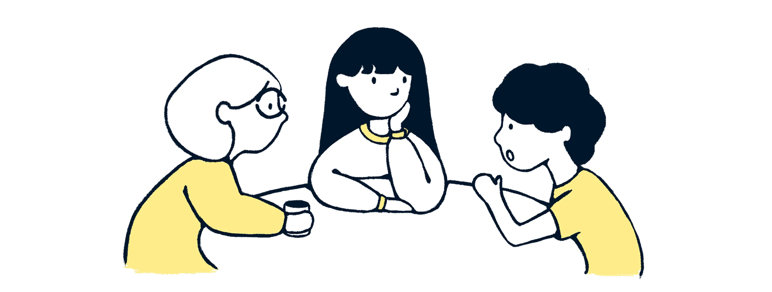 Asian family discuss together at a table.